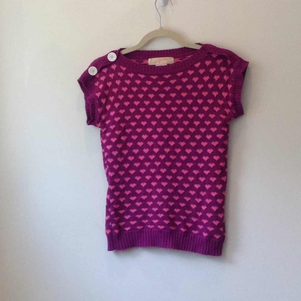 Purple short sleeve shirt.